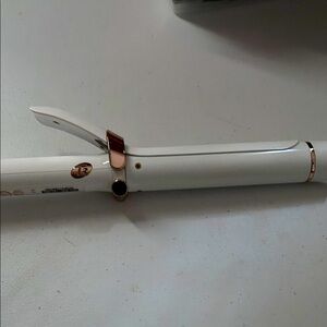 T3 curling iron. Good condition. Barely used. White with gold accents